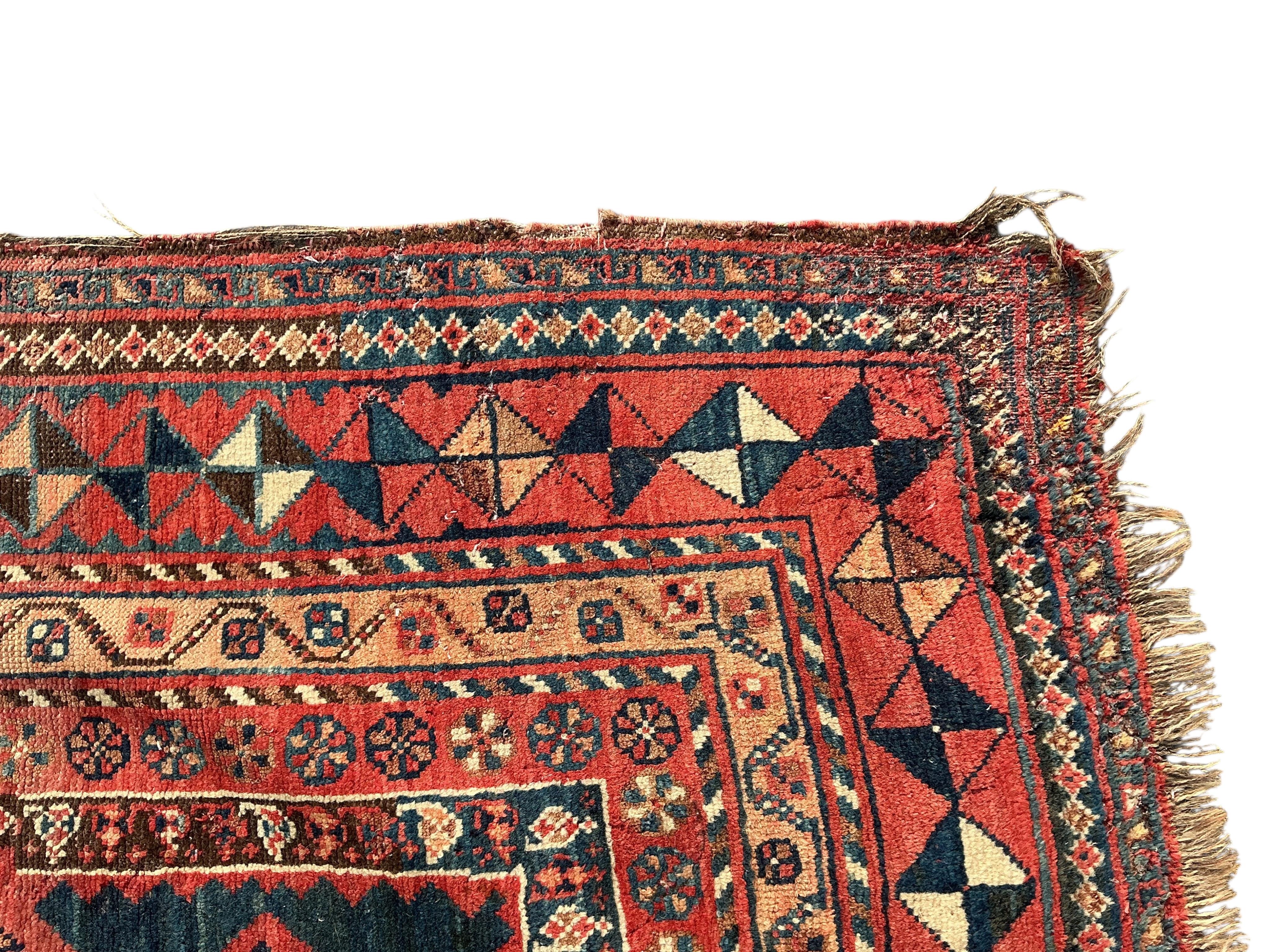 A Belouch blue ground hall carpet, 325cm x 145cm